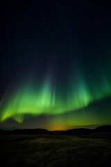 Aurora borealis or northern lights in the night sky.