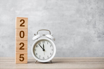 Happy New Year with vintage alarm clock and 2025  block. Christmas, New Start, Resolution,...