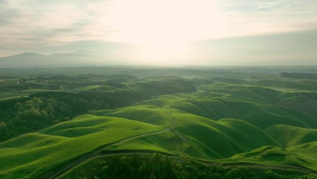 Drone aerial shots of spectacular greenery landscapes and blue sky. Dynamic natural scenery.