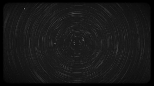 White blurry circular lines animation on black background and old film style frame, glitches, noise and static flickering effects