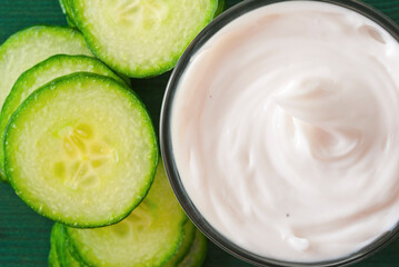 Facial mask with slices of cucumber