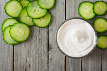 Facial mask with slices of cucumber