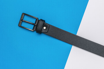 Black Leather Belt with Silver Buckle on Blue and White Background