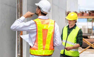 Foreman and workers team meeting for planning project at precast concrete factory site, Site manager and engineer man on construction site