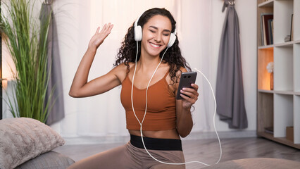 Music gadget. Sound joy. Playlist inspiration. Happy carefree girl in headphones enjoying listening...