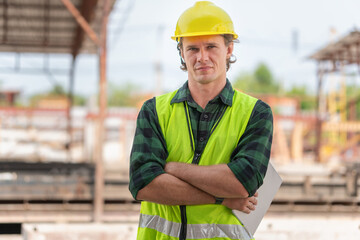 Engineer man arms crossed with digital tablet checking project in the precast concrete factory...