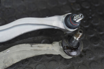 Close-up of worn out front lower control arms bushing ,need to be replaced.