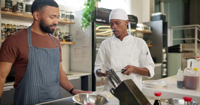 Male chef, cooking and class in kitchen for learn, teacher and food for professional skills. Restaurant, team or culinary student with knife sharpen or honing rod, prepare and cuisine for masterclass
