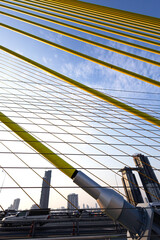 Yellow Cables On A Suspension Bridge Against Blue Sky In Bangkok