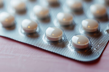 A pack of pills with a silver wrapper