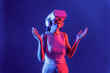 Smart female stand with surrounded by cyberpunk neon light wear VR headset connecting metaverse,...