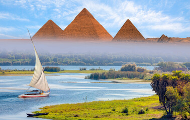 Beautiful Nile scenery with traditional Felluca sailing boat in the Nile on the way to Giza...