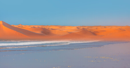 Sahara desert with Atlantic ocean meets near coast - Morocco, North Africa