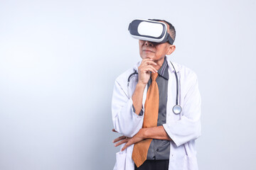 Professional Senior Male Doctor Thinking And Looking Up While Using Virtual Reality Isolated on White Background. 