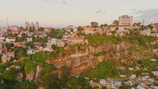 Rova - Queen's Palace with "Antananarivo" sign in Madagascar in sunset. Aerial drone 4K clip.