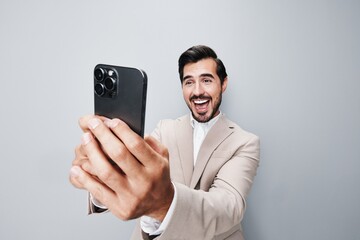 call man background hold phone confident happy suit business portrait smartphone smile