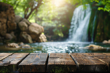 Fototapeta premium A wooden desk top with blurred background of waterfall. Good for background