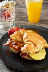 A view of a croissant breakfast sandwich.