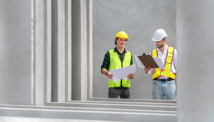 Foreman and workers team meeting for planning project at precast concrete factory site, Site manager and builder on construction site