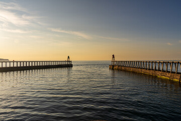 Golden Hour at the West and East Pier in Whitby, England, UK