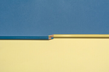 two pencil color in isolated two tone colors.