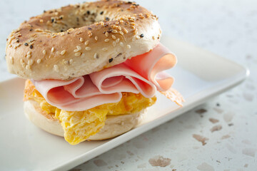 A view of a breakfast bagel sandwich.