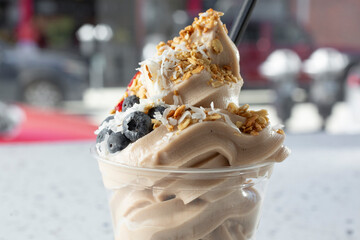 A view of a chocolate frozen yogurt cup.