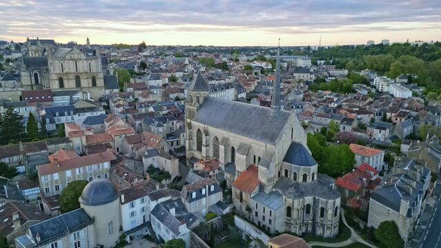 Sainte-Radegonde church and Saint Pierre cathedral, Poitiers in France. Aerial drone sideways