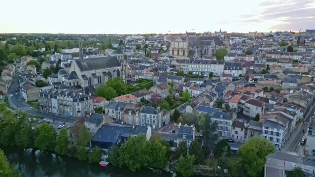 Sainte-Radegonde church and Saint Pierre cathedral, Poitiers in France. Aerial drone forward and cityscape