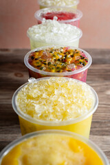 A view of a row of flavored sugarcane juices.