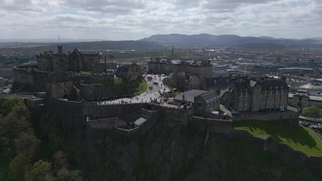 Tourism walking over the castlehill in Edinburgh on a sunny day. Aerial view