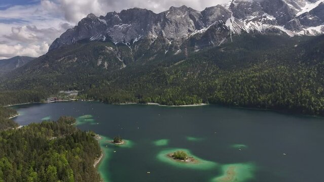 Panaroma drone view Eibsee -Grainau Deutschland- Blue cloudy skies over the mountain