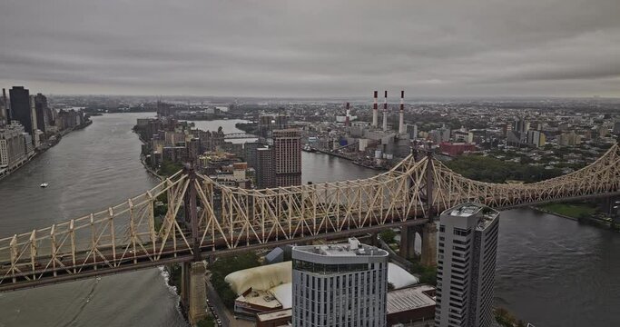 NYC New York Aerial v457 flyover Queensboro bridge over East river and Roosevelt Island capturing Long Island City's skyline with storm clouds overhead - Shot with Mavic 3 Pro Cine - September 2023