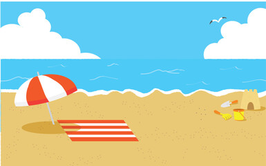 ビーチパラソルと波打ち際の砂のお城