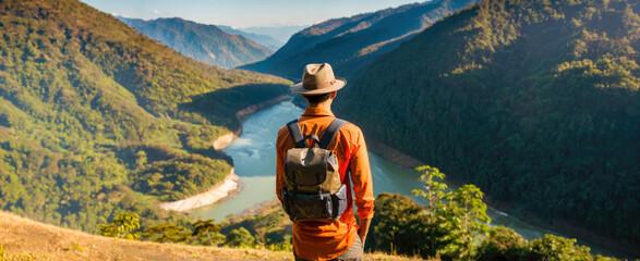 Young Indian Man Enjoying Scenic Mountain Hike in Nature. Travel Concept.