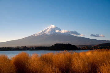 Mount Fuji, the iconic symbol of Japan, during the season of autumn foliage, a period of...