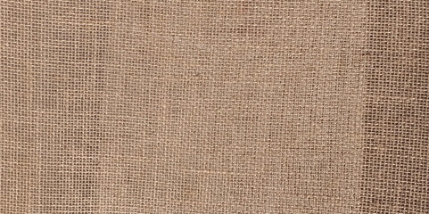 Brown linen fabric texture background, seamless pattern of natural textile. 