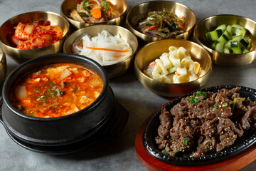 A view of a beef bulgogi, soon tofu, and a variety of banchan.