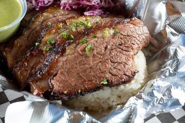 A closeup view of a beef brisket bowl.