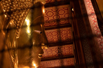 The giant reclining Buddha golden statue is seen at Wat Pho temple complex