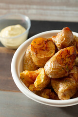 A closeup view of a bowl of roasted fingerling potatoes.