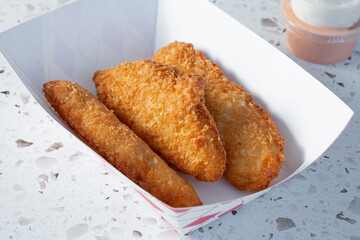 A view of a tray of fish nuggets.
