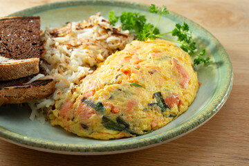 A view of a smoked salmon omelet entree.