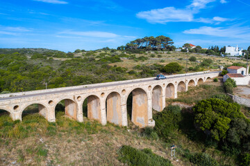 Obraz premium The stone bridge of Katouni built by British in Kythira Greece, with big arches and round openings.