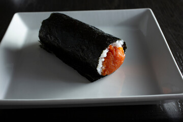 A view of a spicy tuna hand roll.