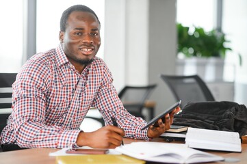 Portrait of african university student in class looking at camera