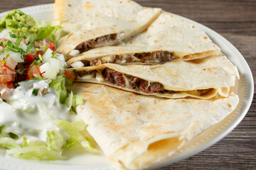 A closeup view of a carne asada quesadilla.