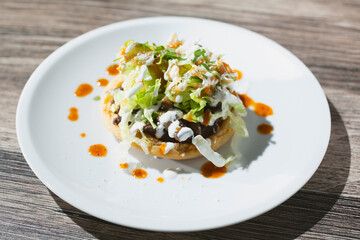 A view of a carne asada sope.