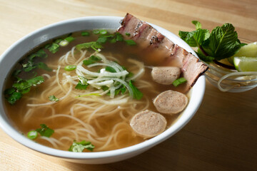 A view of a bowl of smoked brisket pho.