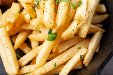 A top down view of a pile of french fries.
